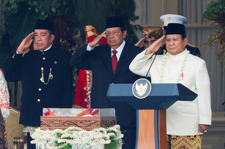 President Prabowo Subianto (right) and former presidents Susilo Bambang Yudhoyono (second right) and Joko “Jokowi“ Widodo (second left) salute the Red and White flag during the annual flag-hoising ceremony to commemorate the 80th Independence Day at the State Palace in Jakarta on Aug. 17, 2025.