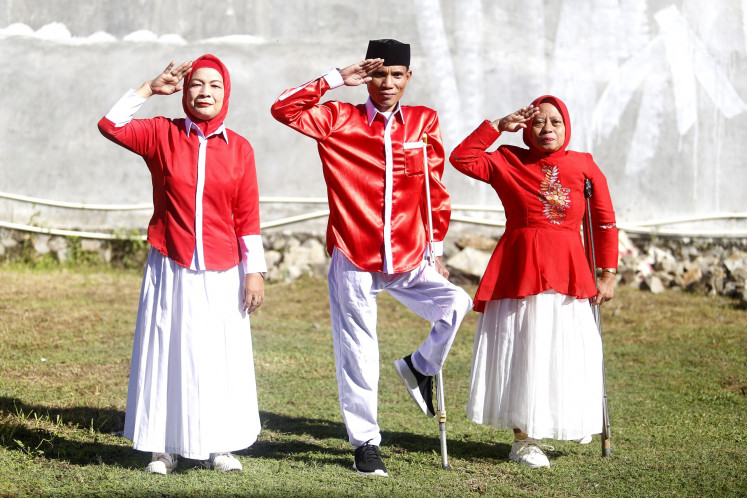 People with disabilities serve in the flag-hoisting squad during a ceremony to commemorate the 80th anniversary of the Independence Day on Aug. 17, in Gorontalo, Gorontalo Province.