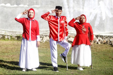 People with disabilities serve in the flag-hoisting squad during a ceremony to commemorate the 80th anniversary of the Independence Day on Aug. 17, in Gorontalo, Gorontalo Province.