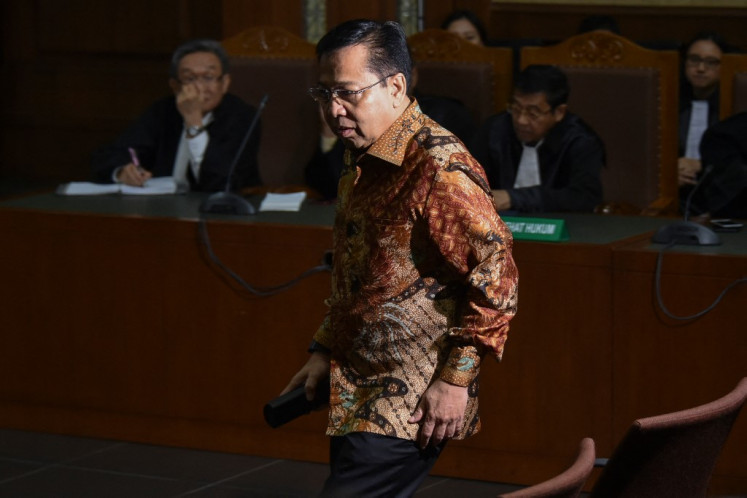 Former House of Representatives (DPR) speaker and Golkar Party chairman Setya Novanto sits in the courtroom on April 24, 2018, during his verdict hearing at the Jakarta Corruption Court in Jakarta. Setya Novanto, once among Indonesia's most influential politicians, had been accused of taking millions in kickbacks and bribes linked to the issuance of e-ID.