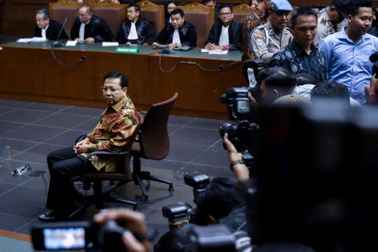 Former House of Representatives speaker and Golkar Party chairman Setya Novanto sits in the courtroom on April 24, 2018, during a hearing at the Jakarta Corruption Court in Jakarta. Setya, once among Indonesia's most influential politicians, was accused of taking millions in kickbacks and bribes linked to the issuance of e-IDs. 