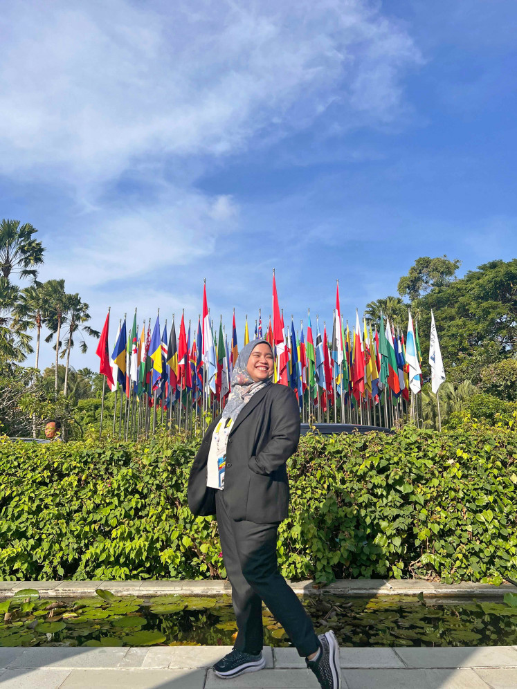 Puspa, a civil servant seen here at the Group of 20 Summit in Bali, values the kind of slow living Indonesia offers.