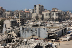 A general view shows the destroyed Rashad al-Shawa cultural center in Gaza City on August 18, 2025. Rights group Amnesty International on August 18, accused Israel of enacting a “deliberate policy“ of starvation in Gaza, as the United Nations and aid groups warn of famine in the Palestinian territory. Israel, while heavily restricting aid allowed into the Gaza Strip, has repeatedly rejected claims of deliberate starvation in the 22-month-old war.