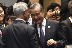 China's Foreign Minister Wang Yi (right) interacts with India's Foreign Minister Subrahmanyam Jaishankar during the 14th East Asia Summit Foreign Ministers' Meeting at the 57th ASEAN Foreign Ministers' Meeting in Vientiane on July 27, 2024.