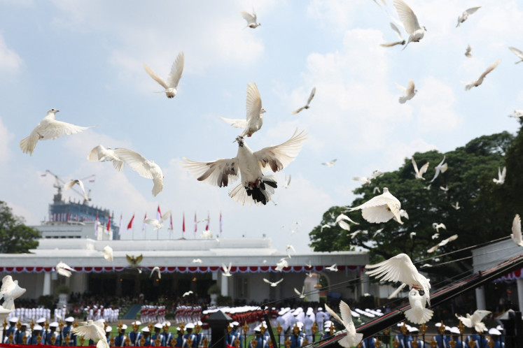 Pigeons fly during the flag-hoisting ceremony to commemorate the 80th anniversary of Independence Day on Aug. 17 at the Merdeka Palace in Jakarta.