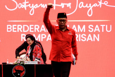Indonesian Democratic Party of Struggle (PDI-P) chair Megawati Soekarnoputri (left) sits down after greeting party secretary-general Hasto Kristiyanto (right) during the party congress at the Bali nusa Dua Convention Center in Nusa Dua, Bali on Aug. 2, 2025. 
