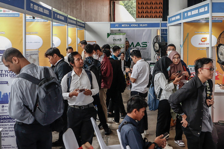 Visitors seek information about job opening in the JobFest 2025 at the Jakarta International Velodrome in Jakarta on Aug. 19, 2025.
