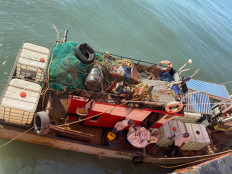 A boat is carrying a new supply of food and fresh water for the abandoned crew of Gas Falcon LNG tanker off Beira, Mozambique, on Saturday, Aug. 16, 2025. The fresh supply was sent by the Indonesian Embassy in Maputo