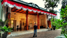 Restoring legacy: Architect Arya Triadi stands in front of the main house at Cikini 82. It took him one year and 10 months to renovate the 2,950-square-meter heritage site.