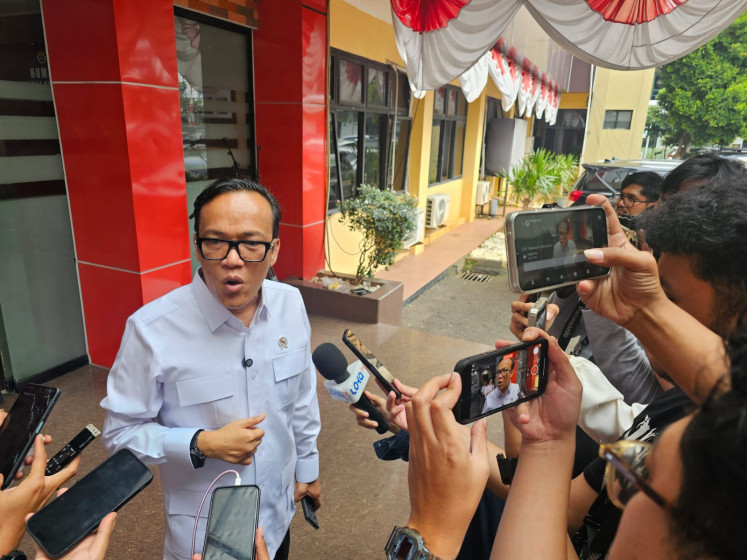 Deputy Manpower Minister Immanuel Ebenezer speaks to reporters about complaints over companies withholding diplomas, at South Jakarta Police headquarters on July 14, 2025.