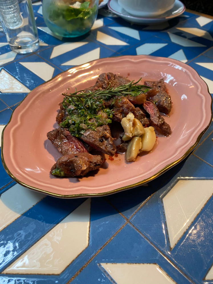Lomo vetado off the live grill, a tender ribeye paired with pebre sauce, anchors COPA’s meat selection.