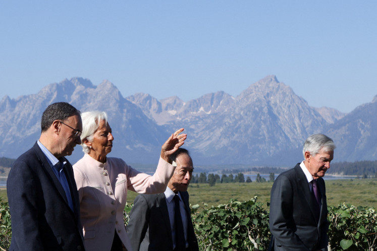 Bank of England Governor Andrew Bailey, European Central Bank President Christine Lagarde, Bank of Japan Governor Kazuo Ueda and Federal Reserve Chairman Jerome Powell walk as they attend the Federal Reserve Bank of Kansas City's 2025 Jackson Hole economic policy symposium, with the theme “Labor Markets in Transition: Demographics, Productivity, and Macroeconomic Policy“ in Jackson Hole, Wyoming, US, on Aug. 22, 2025.