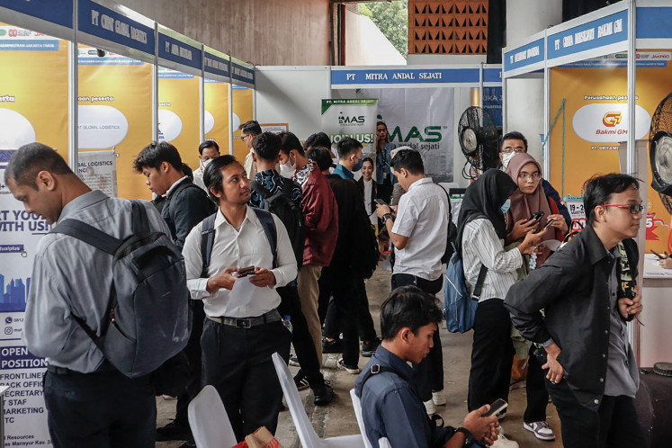 Visitors peruse job vacancy information at JobFest 2025 on Aug. 19 at the Jakarta International Velodrome, Jakarta. The Jakarta administration, through the job fair, helped to offer around 2,000 vacancies from 37 companies. 


