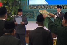 Sworn in: A screenshot shows President Prabowo Subianto (left, facing camera) during an inauguration ceremony to appoint ambassadors and senior officials, including the first heads of the newly created Northern Java Coastal Authority and Mineral Industry Agency, at the State Palace in Jakarta on Aug. 25, 2025.