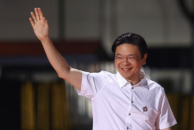 Singaporean Prime Minister Lawrence Wong waves to supporters of his People's Action Party (PAP) on May 3, 2025, as he arrives at the PAP’s election watch party.