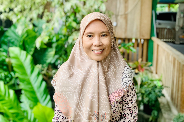 Silent builder: Evi Tampakatu, 49, a humanitarian worker and paralegal, has been supporting women and children affected by conflict and terrorism for over a decade in Poso, Central Sulawesi.