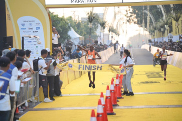 Kenyan runner Evans Nyakamba Mayaka gestures as he crosses the finish line on Aug. 24 in Gianyar, Bali, during the Maybank Marathon 2025, Indonesia's first Elite Label road race, winning the Open Male Marathon with a time of 2:17:01. (Courtesy of Bank Maybank Indonesia)