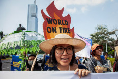 Environmental activists march on Sept. 27, 2024, against 10 years of Joko &ldquo;Jokowi&ldquo; Widodo's presidency's administration, criticizing the worsening climate crisis and democratic backsliding, during the Global Climate Strike 2024 action in Jakarta.
