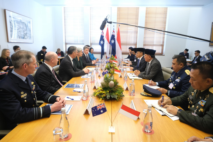 Defense Minister Sjafrie Sjamsoeddin (third right) and Foreign Minsiter Sugiono (fourth right) talk with their counterparts, Australian Defense Minister Richard Marles (third left) and Foreign Minister Penny Wong (fourth left), during the annual 2+2 Indonesia-Australia meeting in Canberra, Australia on Aug. 28, 2025.