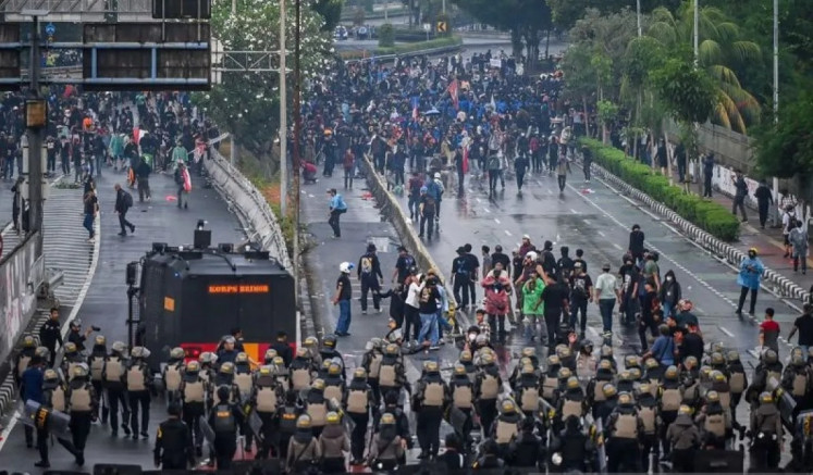 Head-to-head: Students brave security cordons during a rally near the House of Representatives in Senayan, Central Jakarta, on Aug. 28, 2025. 

