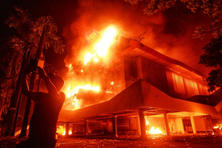 The building of Makassar City Council is set on fire during a protest in Makassar, South Sulawesi, on August 29, 2025. Clashes between protesters and police broke out on August 28 in Jakarta over calls for higher wages and perceived lavish perks for lawmakers, as public discontent grows over the government's handling of the economy.