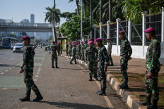 Marines secure positions along a street outside the House of Representatives complex in Jakarta on September 1, 2025. 