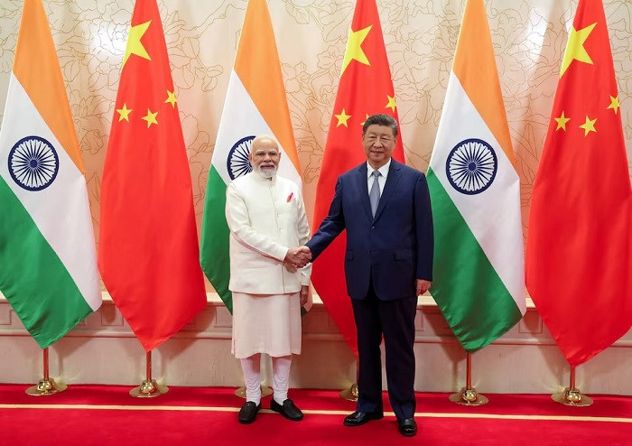 India's Prime Minister Narendra Modi (left) shakes hands with Chinese President Xi Jinping during a meeting on the sidelines of Shanghai Cooperation Organization (SCO) Summit in Tianjin, China, on Aug. 31, 2025. 