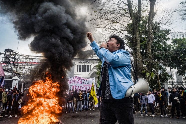A demonstrator shouts slogans during a protest demanding police reform and the dissolution of the West Java Regional Council, in Bandung, West Java on September 1, 2025. 