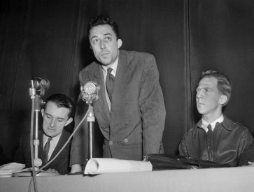 French writer Albert Camus (center) speaks at a meeting in the Salle Pleyel in Paris on December 4, 1948. On the right, American pacifist activist Garry Davis, who launched in September 1948 the movement “Citizens of the world“ by tearing his passport. On the left, French writer Vercors (Jean Bruller). 