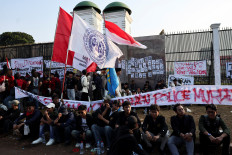 University students gather outside the House of Representatives building during a protest against lawmakers’ housing allowances in Jakarta on Sept. 1, 2025. 