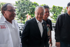 Chaikasem Nitisiri (center), Pheu Thai party's remaining prime ministerial candidate, arrives at the party's headquarters, as rival political camps in Thailand vie to form the next government after the Constitutional Court removed Prime Minister Paetongtarn Shinawatra from office for an ethics violation, in Bangkok, Thailand, September 2, 2025.