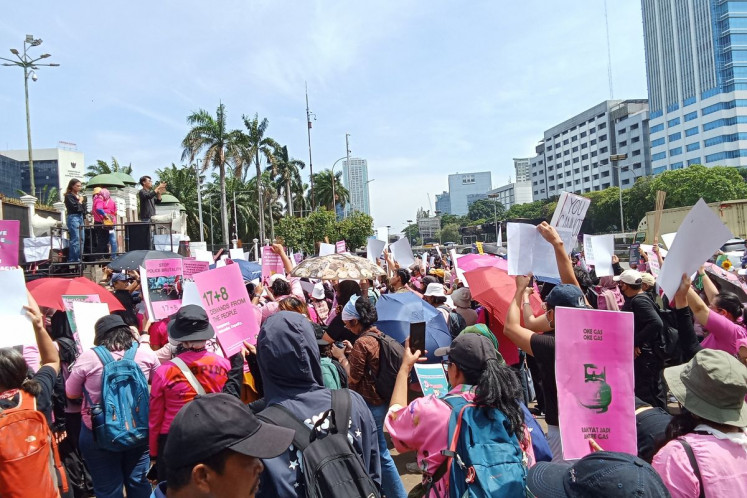 Demonstrators from the Alliance of Indonesian Women rally in front of the House of Representatives building in Jakarta on September 3, 2025.