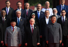 In this pool photograph distributed by the Russian state agency Sputnik, Russia's President Vladimir Putin (front center) poses for a photograph alongside China's President Xi Jinping (right) and Indonesia's President Prabowo Subianto (left) before a military parade marking the 80th anniversary of victory over Japan and the end of World War II, Tiananmen Square on September 3, 2025. 