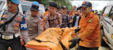Joint search and rescue personnel remove the body of one of the victims from the Eastindo Air helicopter crash in Emil Baru village, Tanah Bumbu regency, South Kalimantan, Sept. 4, 2025. All eight people onboard the BK117-D3 helicopter perished after it crashed on Sept 1, 2025.
