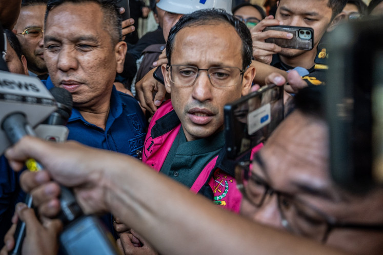 Former education, culture, research and technology minister Nadiem Makarim (center) walks out of the Attorney General's Office (AGO) building in Jakarta on Sept. 4, 2025. The AGO named Nadiem a suspect in a corruption case pertaining to the procurement of Chromebook laptops for schools across the country during his ministerial tenure, which was estimated to have caused around Rp 1.9 trillion in state losses.