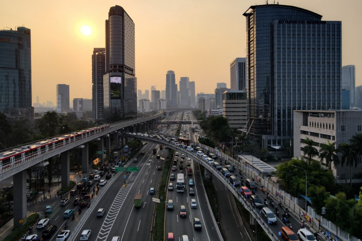This aerial picture shows motorists commuting during the rush hour in Jakarta on August 29, 2023. 