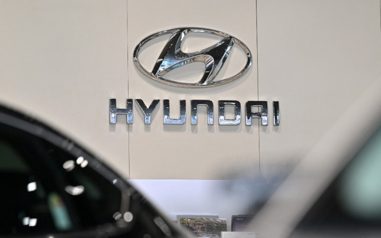 The logo of Hyundai Motor is seen at a car dealership in Seoul on March 27, 2024. More than 300 South Koreans were among 475 people arrested by US immigration officials in a raid on a Hyundai-LG battery plant being built in the southern US state of Georgia, the foreign minister in Seoul said on Sept. 6, 2025.