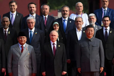 President Prabowo Subianto (left front row) stands next to Russian President Vladimir Putin and Chinese President China Xi Jinping during a military parade on Sept. 3 at Tiananmen Square in Beijing.