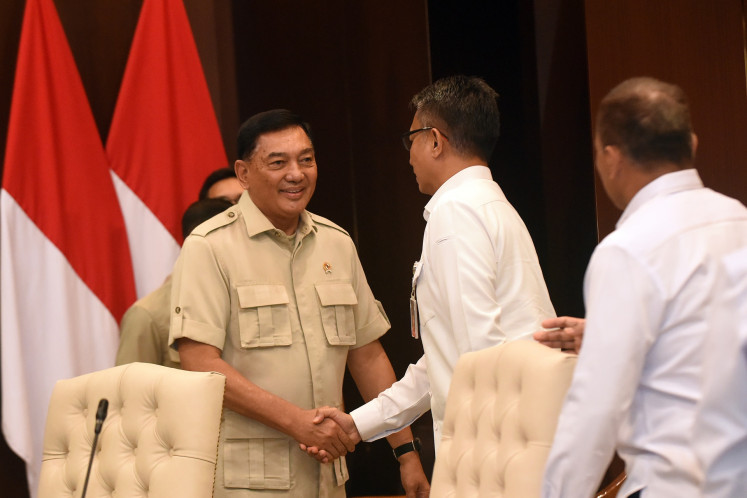 Warm greeting: Ad interim Coordinating Politics and Security Minister Sjafrie Sjamsoeedin (center) shakes hands with his new colleagues ahead of a meeting on Sept. 9 with the Office of Coordinating Politics and Security Minister's undersecretaries in Jakarta. President Prabowo appointed Sjafrie as ad interim coordinatining politics and security minister to replace Budi Gunawan, who was ousted in a recent cabinet reshuffle.