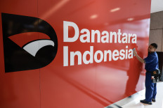 A worker cleans a room on Sept. 8 at Wisma Danantara Indonesia in Jakarta. In its first six months of operation, Danantara recorded several important achievements, including securing US$10 billion in funding, equivalent to Rp163.18 trillion, from a consortium of 12 foreign banks.