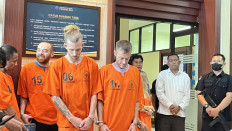 The National Narcotics Agency (BNN) parades five suspects namely Indonesian OF (left), Palestinian MH (second left), United Kingdom citizen KG (center), UK citizen PE (second right) and Ukrainian KT at the BNN Bali headquarters in Denpasar on Sept. 9, 2025.