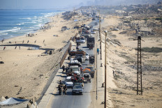 Palestinians transport their belongings as they evacuate Gaza City towards southern areas of the coastal Gaza Strip, on September 11, 2025. 
