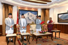 Nepal’s President Ramchandra Paudel (second right) administers the oath of office to former chief justice Sushila Karki (right) as Nepal’s interim prime minister during a swearing-in ceremony at the president's office in Kathmandu, Nepal on Sept. 12, 2025, following violent anti-graft protests.