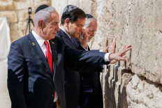 (Left to right) Israel's Prime Minister Benjamin Netanyahu, US Secretary of State Marco Rubio, and US ambassador to Israel Mike Huckabee visit the Western Wall, Judaism's holiest prayer site, in the old city of Jerusalem on September 14, 2025. 