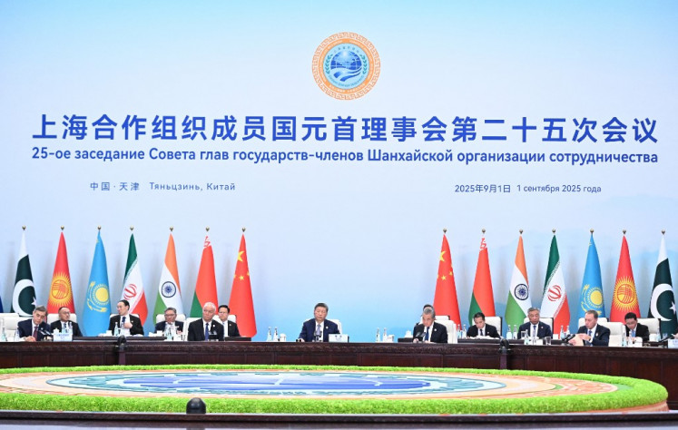 China's President Xi Jinping (center) attends the Shanghai Cooperation Organisation (SCO) in Tianjin on Sept. 1, 2025, in this photograph distributed by the Russian state agency Sputnik.