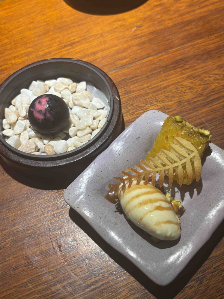 Gemini’s duality takes form in bika ambon and pistachio ice cream, paired with a cherry bonbon.