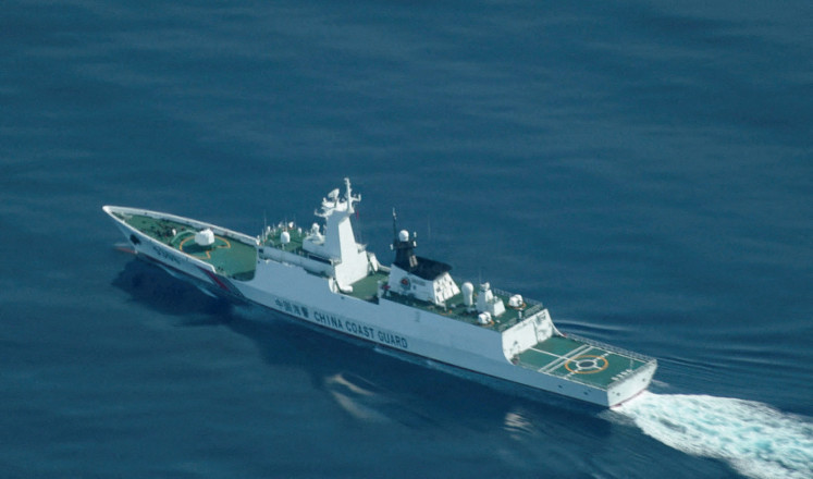 An aerial view of a China Coast Guard ship navigating near the disputed Scarborough Shoal, in the South China Sea, August 13, 2025.
