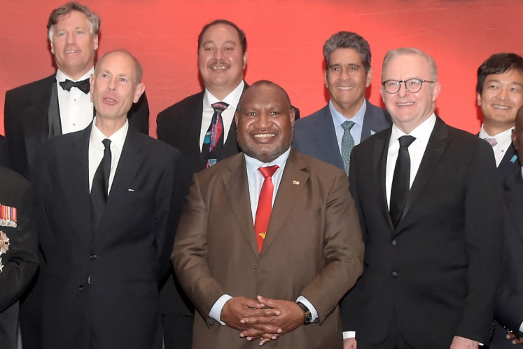 Papua New Guinea's Prime Minister James Marape (center), Britain's Prince Edward, Duke of Edinburgh (front left) and Australia's Prime Minister Anthony Albnanese (front right) and other Pacific leaders pose for a photo during a dinner event on the eve of Papua New Guinea's 50th independence anniversary, in Port Moresby on September 15, 2025.  