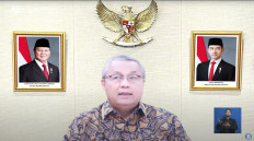 Bank Indonesia (BI) Governor Perry Warjiyo presents the results of the central bank's monthly monetary policy meeting in a live-streamed press conference on Sept. 17, 2025.