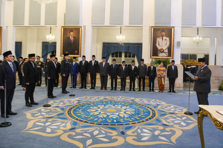 President Prabowo Subianto (right) reads the oath of office while inaugurating new cabinet members at the State Palace in Jakarta on Sept. 17, 2025. 